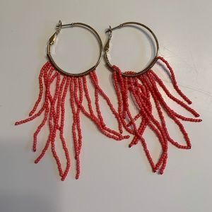 Gold hoop earrings with coral dangled accent!